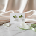GREEN BOW ROSE DANGLES Background